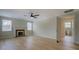 Bright living room features beautiful hardwood floors, a fireplace, and an entrance to the bathroom at 4131 Carroll Sw St, Covington, GA 30014