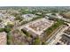 Extensive aerial view showcasing a dense residential area with townhomes nestled amongst lush trees at 420 Copeland St, Grayson, GA 30017