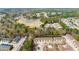 Aerial view showcasing townhomes nestled near a scenic pond and lush greenery, a nature setting at 420 Copeland St, Grayson, GA 30017