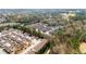 An aerial view of a neighborhood with mature trees and well-maintained landscaping at 420 Copeland St, Grayson, GA 30017