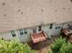 Aerial view of a townhome backyard with a private deck and well-maintained landscaping at 420 Copeland St, Grayson, GA 30017
