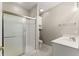Bright bathroom features a glass-enclosed shower, white vanity, and sleek fixtures for a modern feel at 420 Copeland St, Grayson, GA 30017