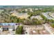 Aerial view of a townhome community with nearby single-Gathering home residences and beautiful greenery at 420 Copeland St, Grayson, GA 30017