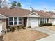 Well-maintained single-story home showcasing a one-car garage, lovely landscaping, and a welcoming facade at 420 Copeland St, Grayson, GA 30017