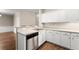 Kitchen features a stainless steel dishwasher, solid surface countertops, and white cabinets at 420 Copeland St, Grayson, GA 30017