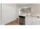 Kitchen includes stainless dishwasher, double sink, white cabinets, and adjacent dining space at 420 Copeland St, Grayson, GA 30017