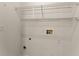 Empty laundry room features wire shelving and utility hook-ups at 420 Copeland St, Grayson, GA 30017