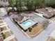 Aerial view of community pool and clubhouse with ample parking in a well-kept neighborhood at 420 Copeland St, Grayson, GA 30017