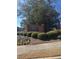 Welcoming brick entrance sign surrounded by colorful flowers and lush greenery at 420 Copeland St, Grayson, GA 30017