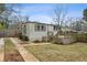 Backyard featuring a wooden deck, shed, and grassy area at 49 Wyman Se St, Atlanta, GA 30317