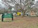 A vibrant playground in Coan Park, perfect for families, with a sign indicating park hours at 49 Wyman Se St, Atlanta, GA 30317