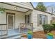 Inviting front porch with seating area and stylish decor, perfect for relaxing outdoors at 49 Wyman Se St, Atlanta, GA 30317