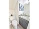 Bathroom featuring modern vanity with granite countertop and tiled floor at 6242 Marbut Farms Ln, Lithonia, GA 30058