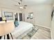 Bright bedroom boasts a vaulted ceiling, ceiling fan, and chic decor at 6242 Marbut Farms Ln, Lithonia, GA 30058