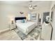 Inviting bedroom with a vaulted ceiling, ceiling fan, and neutral decor at 6242 Marbut Farms Ln, Lithonia, GA 30058