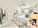 Cozy bedroom featuring vaulted ceiling, modern decor, and ample natural light at 6242 Marbut Farms Ln, Lithonia, GA 30058