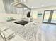 Modern kitchen features gray cabinets, granite countertops, and stainless steel appliances at 6242 Marbut Farms Ln, Lithonia, GA 30058