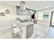 Stylish kitchen featuring stainless steel appliances, granite countertops, and an island with bar seating at 6242 Marbut Farms Ln, Lithonia, GA 30058