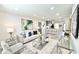 Cozy living room showcasing open layout to kitchen and contemporary furnishings at 6242 Marbut Farms Ln, Lithonia, GA 30058