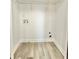 Empty walk-in closet with laminate flooring, white walls, and wire shelving at 6242 Marbut Farms Ln, Lithonia, GA 30058