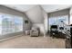 Bedroom with neutral colors, sloped ceilings, and a study area at 6610 River Crest Pt, Suwanee, GA 30024