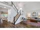 Open-concept foyer featuring a staircase and seamlessly connecting to the living room at 6610 River Crest Pt, Suwanee, GA 30024