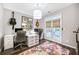 Home office with dual desks, stylish decor, and French doors leading to the outdoors at 6610 River Crest Pt, Suwanee, GA 30024