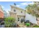 Back of house shows cozy backyard with patio and outdoor seating at 1976 Drennon Ave, Austell, GA 30106