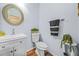 Charming powder room with modern fixtures, wood floors, and stylish decor at 1976 Drennon Ave, Austell, GA 30106