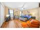 Bright bedroom features hardwood floors, ceiling fan, and lots of natural light at 1976 Drennon Ave, Austell, GA 30106
