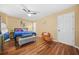 Bedroom with hardwood floors and large bed, and a ceiling fan at 1976 Drennon Ave, Austell, GA 30106