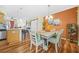 Inviting dining room with hardwood floors, designer lighting, and seating for six at 1976 Drennon Ave, Austell, GA 30106