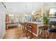 Bright open kitchen with breakfast bar, stainless steel appliances, and hardwood floors at 1976 Drennon Ave, Austell, GA 30106