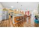 Open concept living area with kitchen island and barstool seating, and stainless steel appliances at 1976 Drennon Ave, Austell, GA 30106