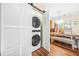 Convenient laundry area with a stacked washer and dryer located near the dining room at 1976 Drennon Ave, Austell, GA 30106