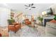 Cozy living room with fireplace, wood floors, and open to the kitchen at 1976 Drennon Ave, Austell, GA 30106