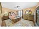 Comfortable main bedroom with neutral walls, wood floors and lots of natural light at 1976 Drennon Ave, Austell, GA 30106