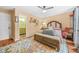 Comfortable main bedroom with neutral walls, wood floors and en-suite bathroom at 1976 Drennon Ave, Austell, GA 30106