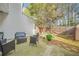 Back patio with patio furniture and privacy fence is perfect for outdoor living at 1976 Drennon Ave, Austell, GA 30106