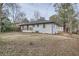 View of the home featuring a white exterior, deck, and spacious yard at 2091 Parker Ranch Se Rd, Atlanta, GA 30316