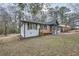 Renovated single-story home features a covered front porch and a freshly painted white brick exterior at 2091 Parker Ranch Se Rd, Atlanta, GA 30316