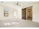 Bright bedroom with a ceiling fan and a barn door entrance at 3090 Maple Ln, Alpharetta, GA 30009