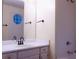 Bright bathroom with a blue decorative window, tub, shower, and vanity providing a functional space at 3736 Soapstone Rd, Decatur, GA 30034