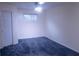 Inviting carpeted bedroom with a ceiling fan and window, offering a comfortable and serene space at 3736 Soapstone Rd, Decatur, GA 30034
