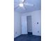 Carpeted bedroom with an open closet provides ample storage, enhancing the room's functionality at 3736 Soapstone Rd, Decatur, GA 30034
