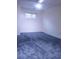 Spacious carpeted bedroom with a ceiling fan and window, offering a comfortable and serene space at 3736 Soapstone Rd, Decatur, GA 30034