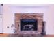 Stone fireplace with tiled hearth at 3736 Soapstone Rd, Decatur, GA 30034