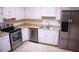 Bright kitchen with stainless steel appliances and white cabinets at 3736 Soapstone Rd, Decatur, GA 30034