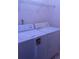 Bright laundry room features washer, dryer, and metal rack for storage at 3736 Soapstone Rd, Decatur, GA 30034