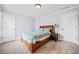 Bedroom with neutral colored carpet, ceiling fan, and two doors at 401 Nichols Dr, Suwanee, GA 30024